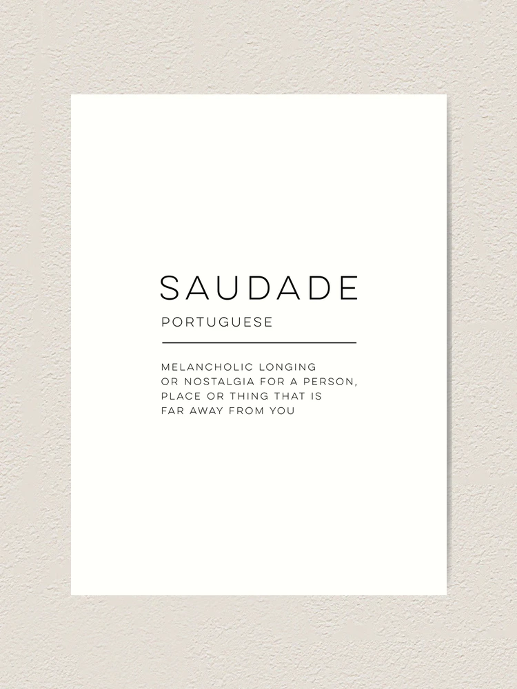 Saudade, Portuguese word meaning nostalgia or longing composed with yellow  colored stone letters over green sand Stock Photo - Alamy