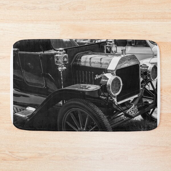 Item preview, Black and white image of the front of a red Ford Model T on display at a car show designed and sold by Graham Cornall.