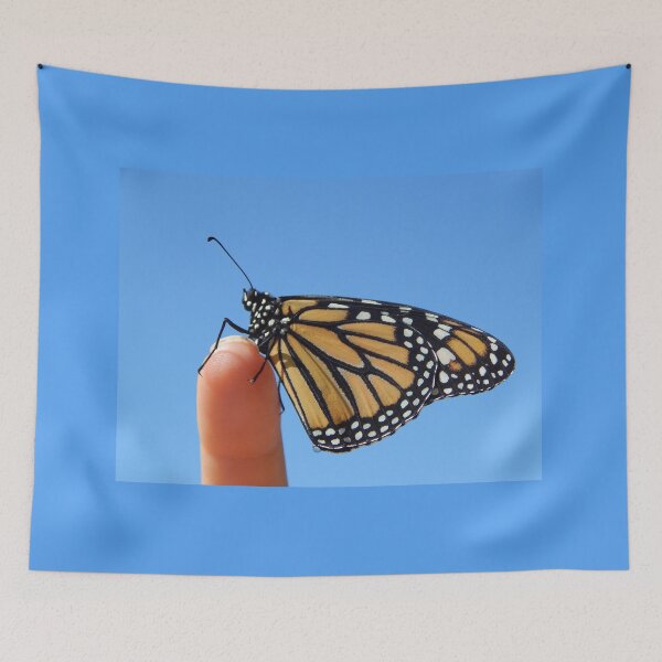 Item preview, Monarch butterfly on a finger and blue sky designed and sold by Stephanie  Skeem.
