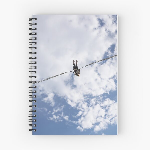 Item preview, Girl in slingshot against blue cloudy sky designed and sold by lena-maximova.