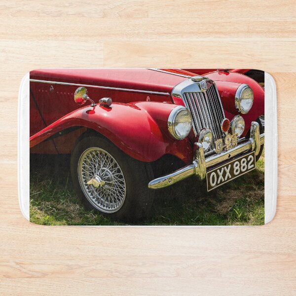 Item preview, The front of a red 1954 MG TF on display at a car show designed and sold by Graham Cornall.