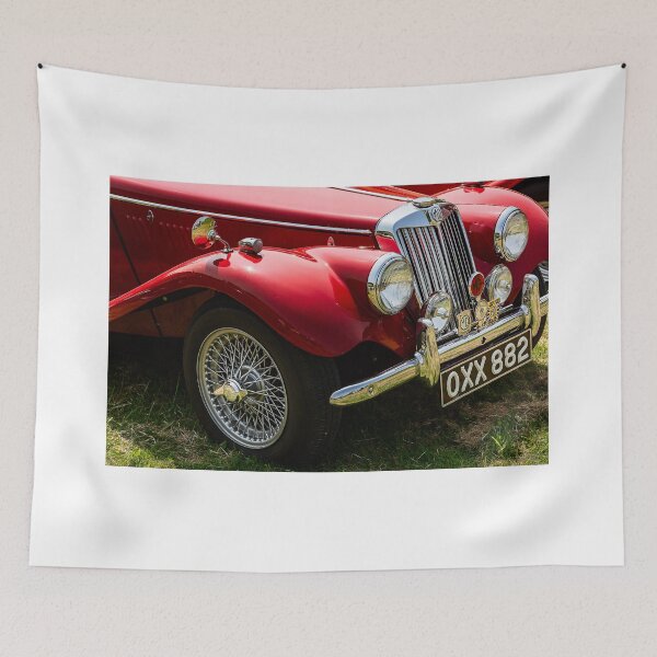 Item preview, The front of a red 1954 MG TF on display at a car show designed and sold by Graham Cornall.