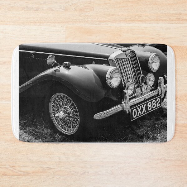 Item preview, A black and white image ofthe front of a red 1954 MG TF on display at a car show designed and sold by Graham Cornall.