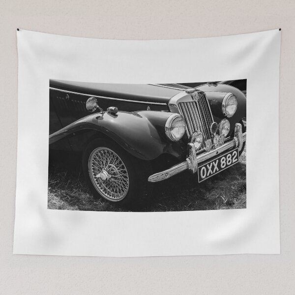 Item preview, A black and white image ofthe front of a red 1954 MG TF on display at a car show designed and sold by Graham Cornall.