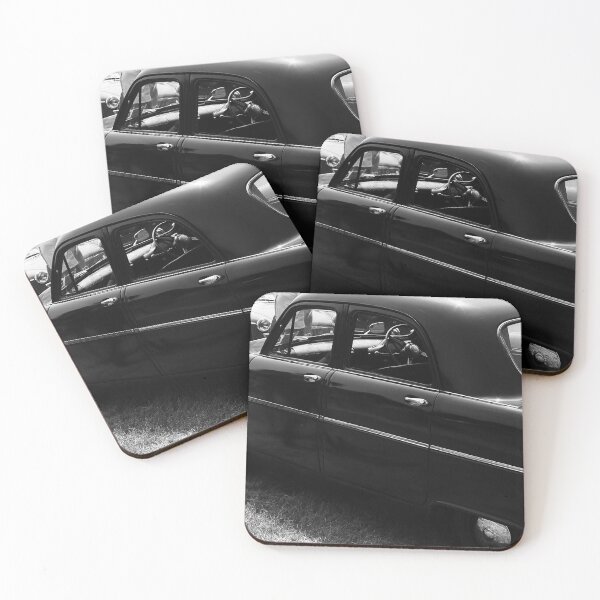 Item preview, A black and white image of the side of a black 1955 Ford Consul on display at a car show designed and sold by Graham Cornall.