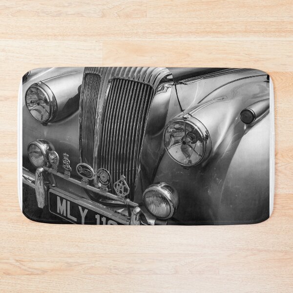 Item preview, A black and white image of the front of a blue and silver 1952 Daimler DB18 Consort on display at a car show designed and sold by Graham Cornall.