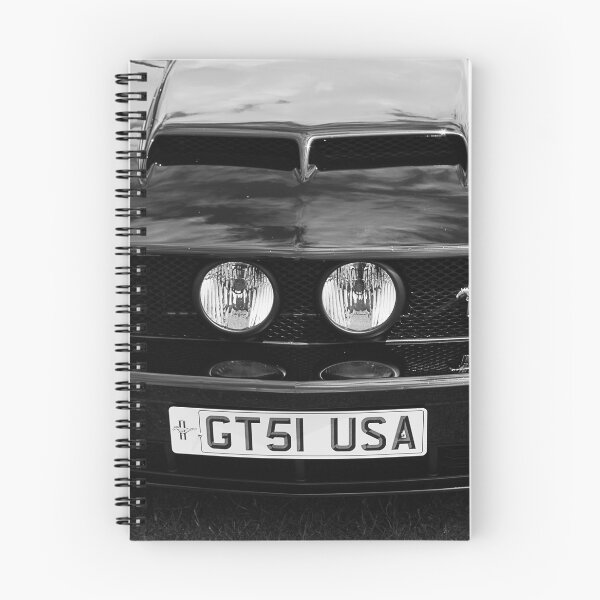 Item preview, A black and white image of the front of a black 2006 Ford Mustang GT on display at a car show designed and sold by Graham Cornall.