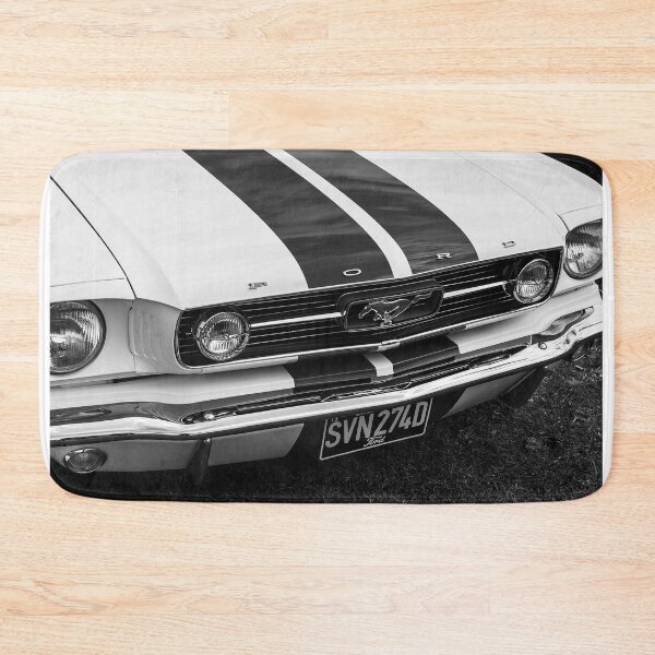 Item preview, A black and white image of the front of a white 1966 Ford Mustang on display at a car show designed and sold by Graham Cornall.