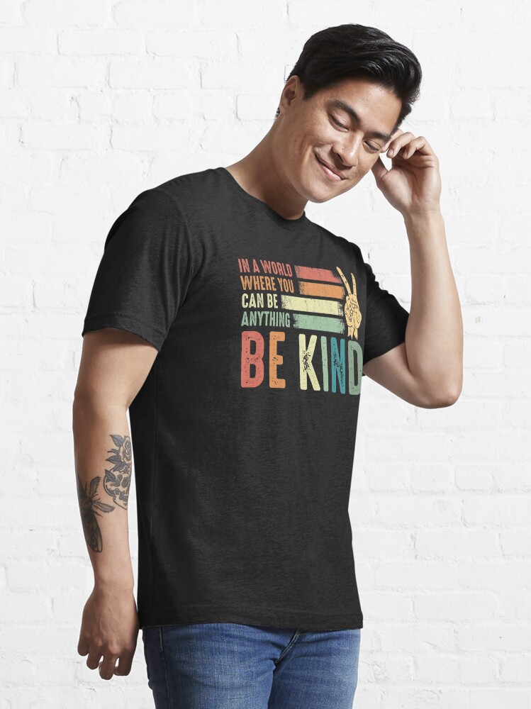 Disover In a world where you can be anything be kind kindness inspirational gifts Peace hand sign | Essential T-Shirt 