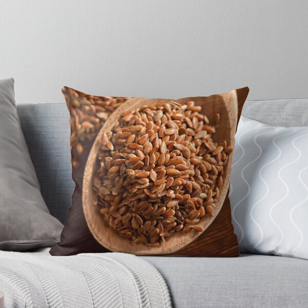 Item preview, Brown linseeds portion on wooden spoon designed and sold by Arletta Cwalina.