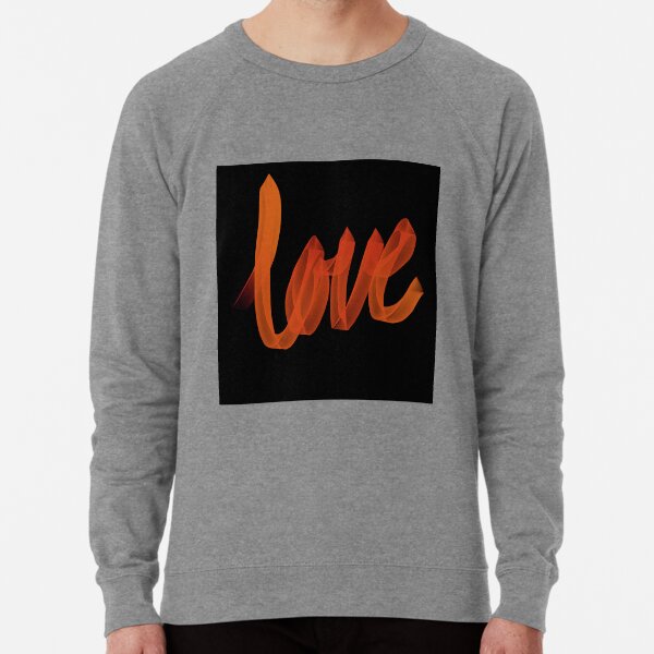 Orange sweatshirt with black writing shop