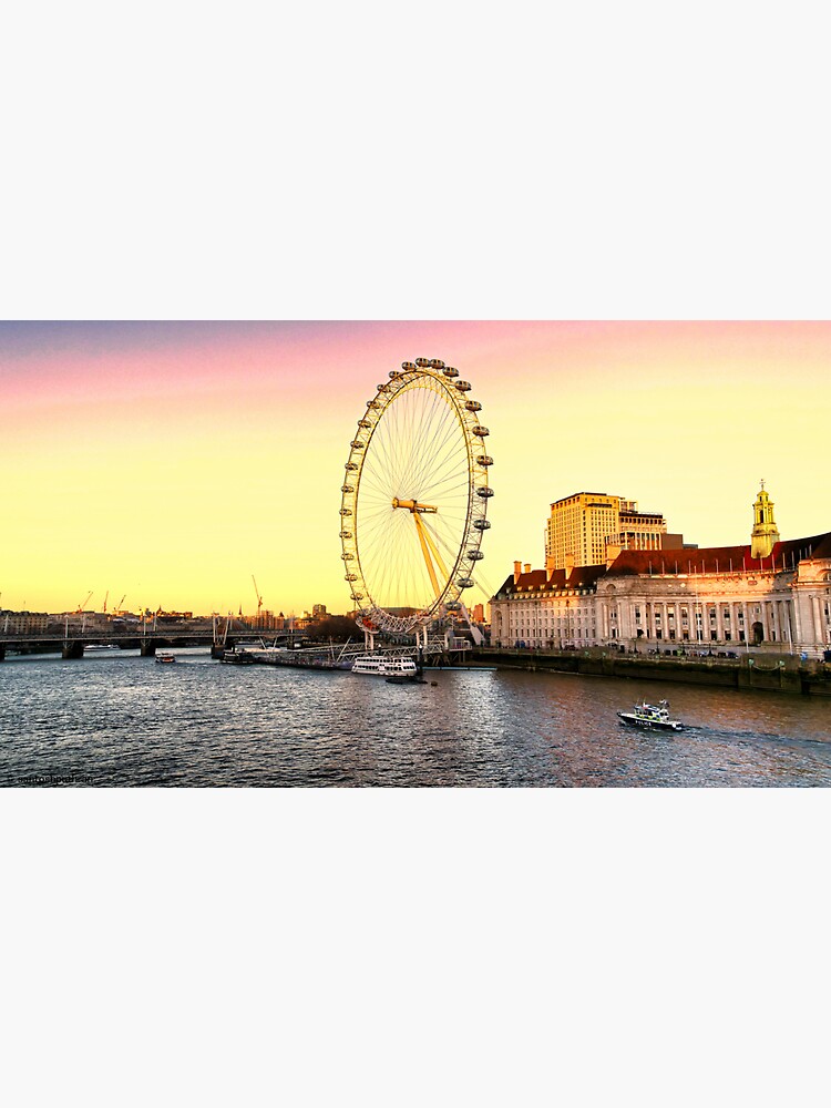 London Eye and the buildings next to River Thames by santoshputhran