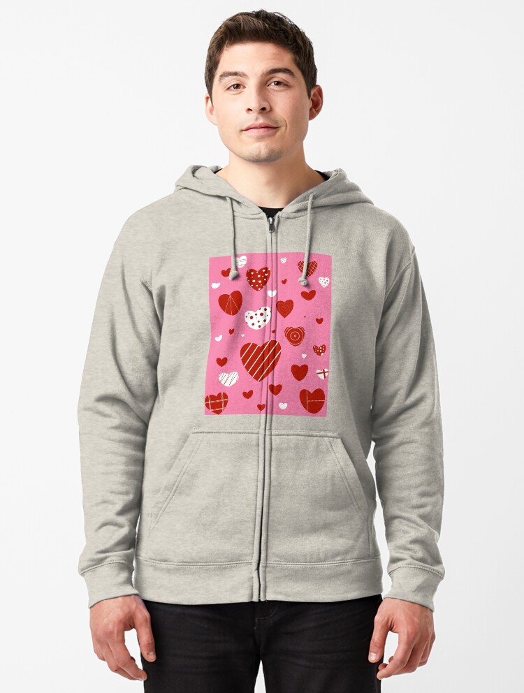 white sweatshirt with red hearts