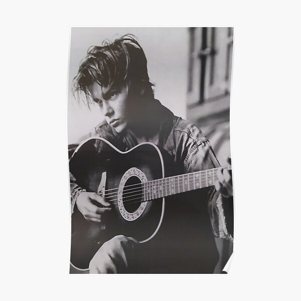 RIVER PHOENIX PLAYING THE GUITAR WITH MELANCOLIC AIR Poster