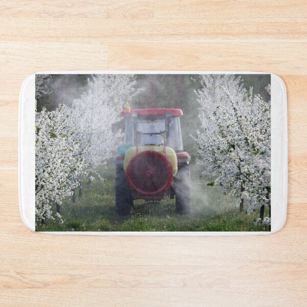 Item preview, tractor sprays insecticide in cherry orchard in spring  agriculture designed and sold by goceris.