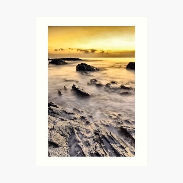 sunrise in a rock beach Art Print