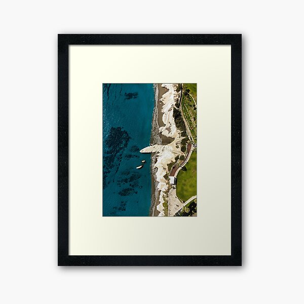 Beach caves and white rocks Framed Art Print