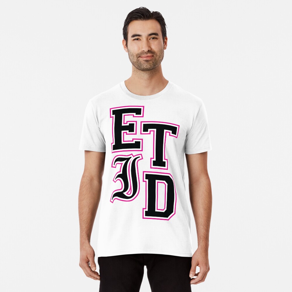 pink shirt with black letters