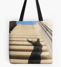 Man casting shadow on steps Tote Bag