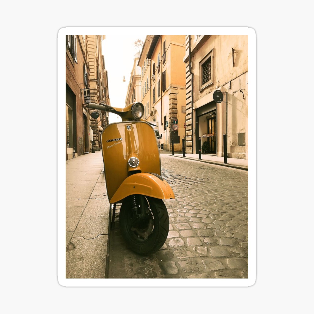Yellow vespa motorcycle on the street in Italy \