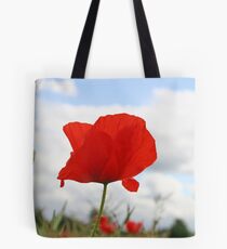 Single Poppy against blue sky Tote Bag