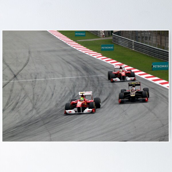 Ferarri's Massa overtakes Lotus Renault's Petrov Poster