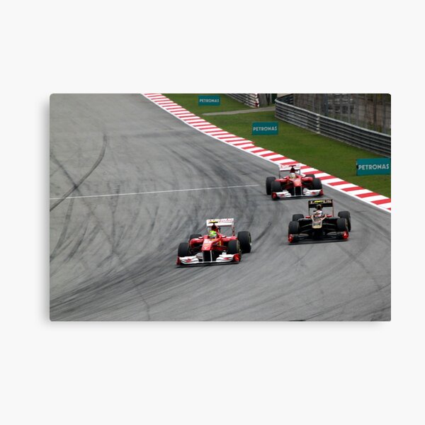 Ferarri's Massa overtakes Lotus Renault's Petrov Canvas Print