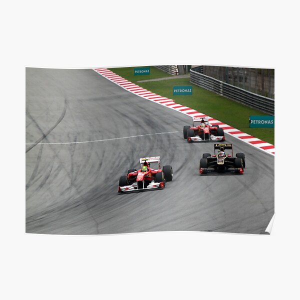 Ferarri's Massa overtakes Lotus Renault's Petrov Poster