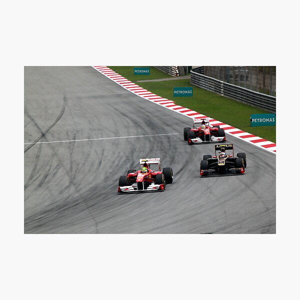 Ferarri's Massa overtakes Lotus Renault's Petrov Photographic Print