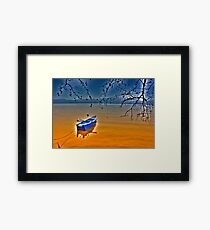 Boat in snow with blue sky Framed Print