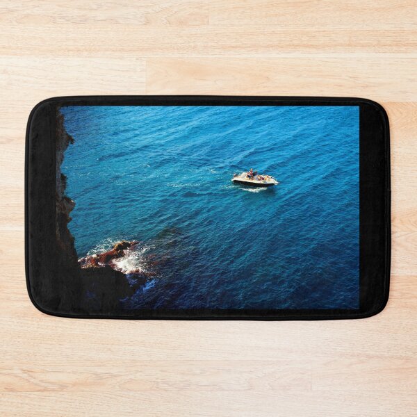 Item preview, View from a high rocky shore of Polignano a Mare at a boat in the Adriatic sea designed and sold by Kristina Drozd.