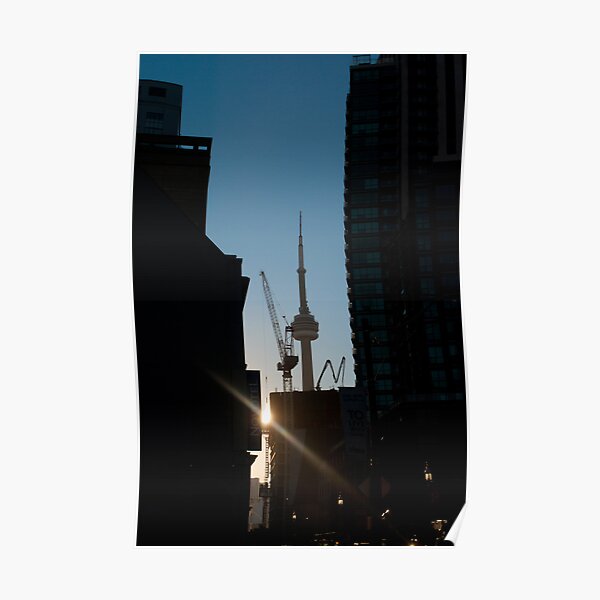 Sun Setting On CN Tower Framed By Towers Poster