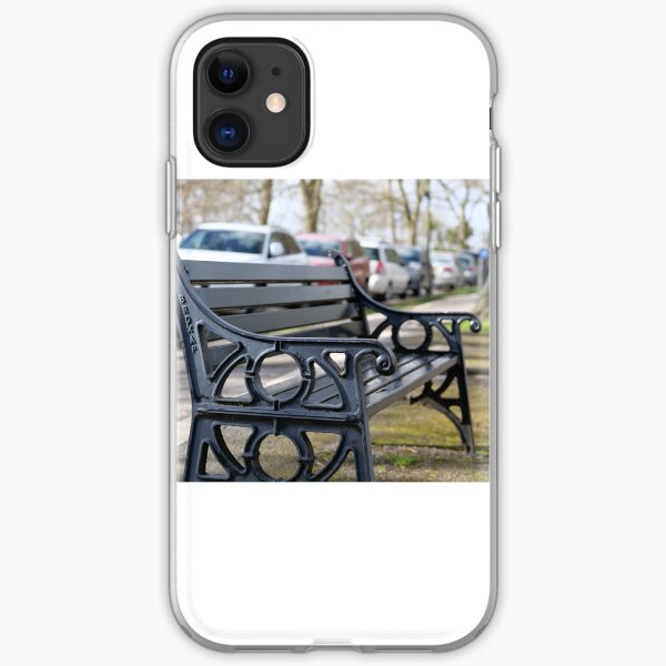 Bench for people to sit along the Thames river embankment in Windsor, Berkshire, England, UK iPhone Soft Case