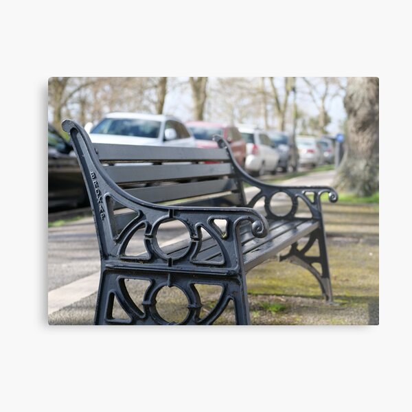 Bench for people to sit along the Thames river embankment in Windsor, Berkshire, England, UK Metal Print