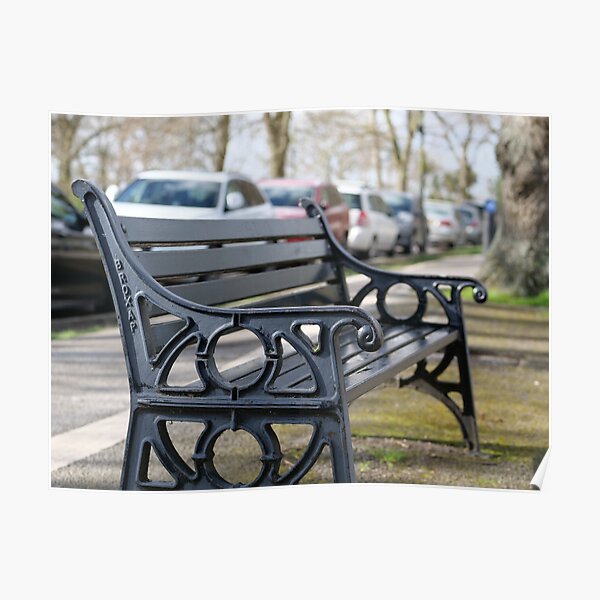Bench for people to sit along the Thames river embankment in Windsor, Berkshire, England, UK Poster