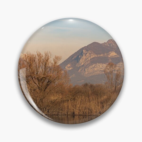 Item preview, Tree in the foreground and mountains in the background are reflected in the river water designed and sold by brambillasimone.