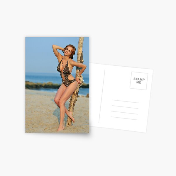 Young redhead girl on the beach standing pretty in designers swimsuit Postcard