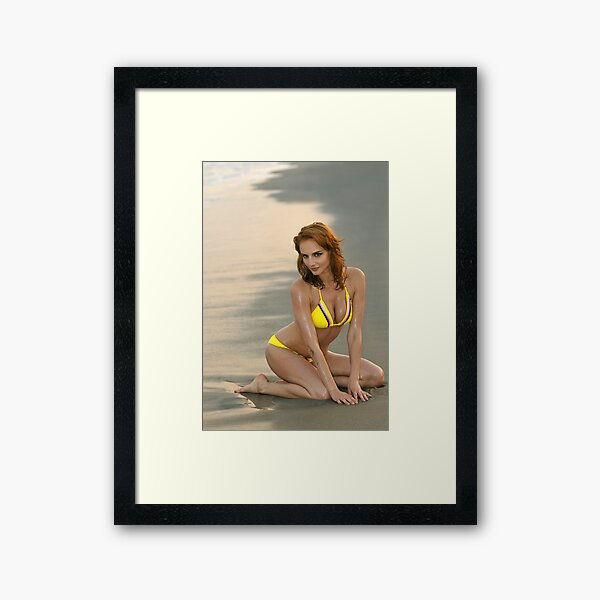 Fashion model in custom design yellow bikini sitting pretty on the sunset beach in Reese Park, NY Framed Art Print