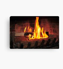 Burning fire at fireplace. Can be used as background. Canvas Print