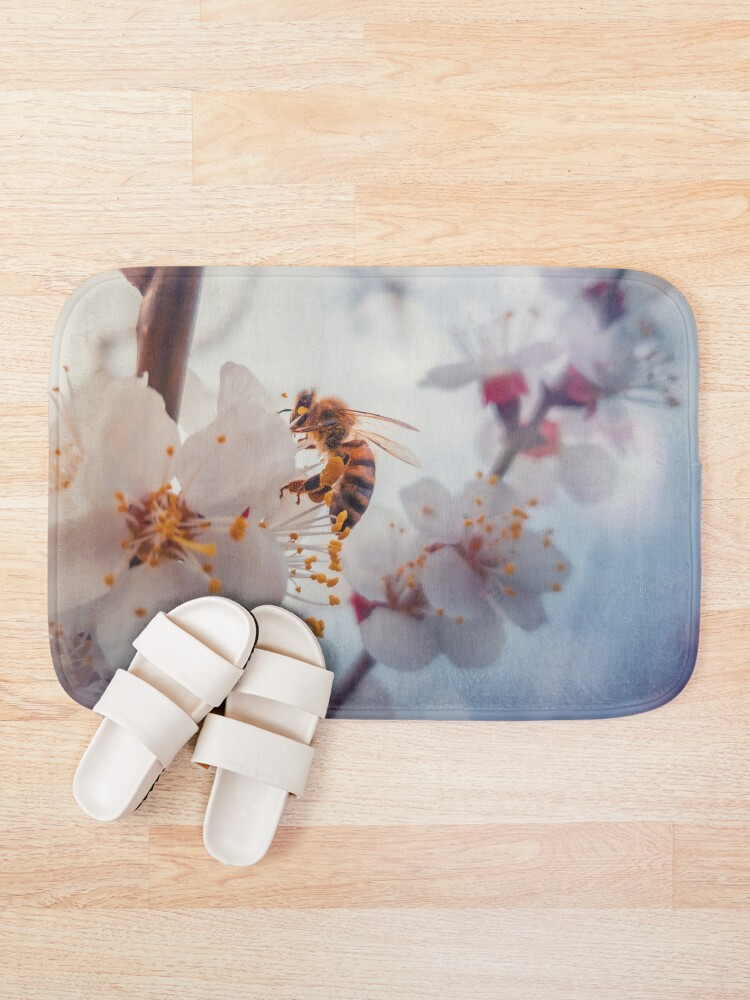 Alternate view of honey bee on apricot flowers Bath Mat