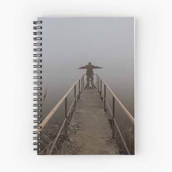 Item preview, Man with open arms on a frozen pier shrouded in mist designed and sold by brambillasimone.