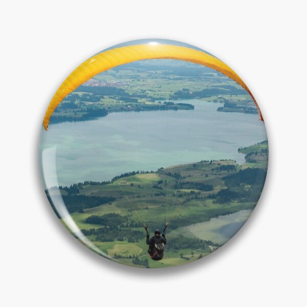 Item preview, A paraglider flying over Forggensee and Bannwaldsee lakes in Bavaria, Germany designed and sold by AlizadaStudios.