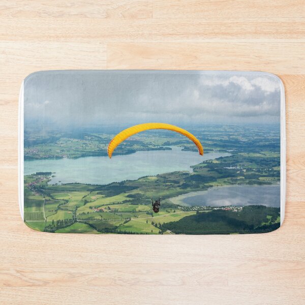 Item preview, A paraglider flying over Forggensee and Bannwaldsee lakes in Bavaria, Germany designed and sold by AlizadaStudios.