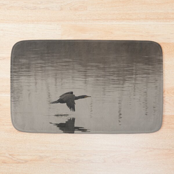 Item preview, The great cormorant flies at water level over a river designed and sold by brambillasimone.