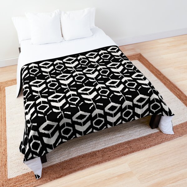 White flower pattern on a black background Comforter