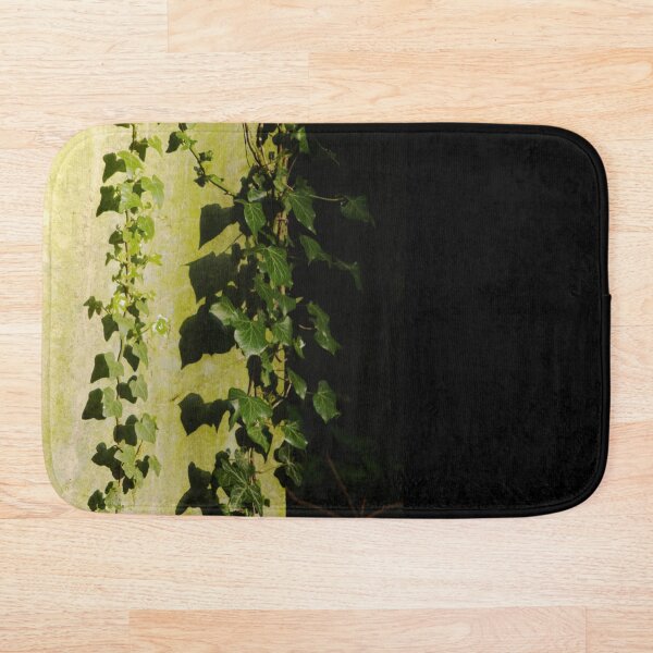 Trailing ivy on grave Bath Mat