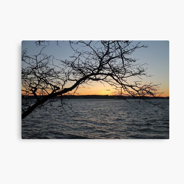 Sunset, also known as sundown, is the daily disappearance of the Sun below the horizon due to Earth's rotation Canvas Print