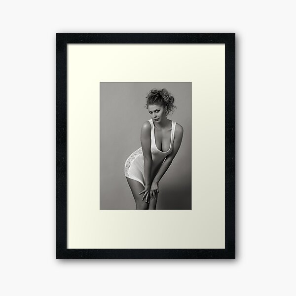 Beautiful blond girl standing in wet tee-shirt Framed Art Print