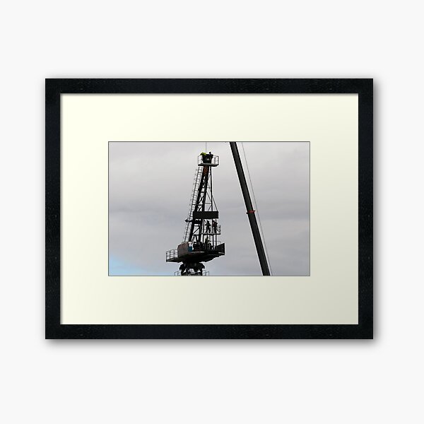 Riggers assembling a Construction Crane on Multistory Units. May 5, 2019. Part of a series. Framed Art Print