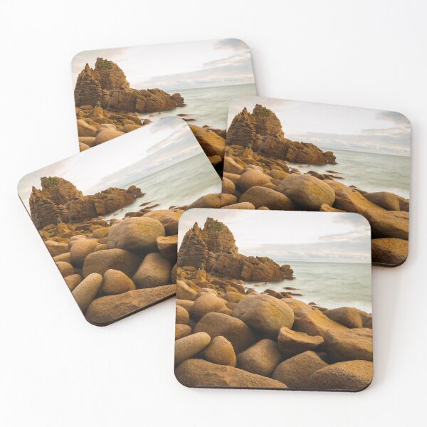 Item preview, Slow moving waves crashing on a beach with mysterious rock formations designed and sold by DesignBoard Photography.